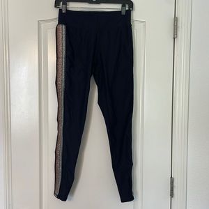 Black Terez leggings with metallic stripes down outside of leg. Size M.